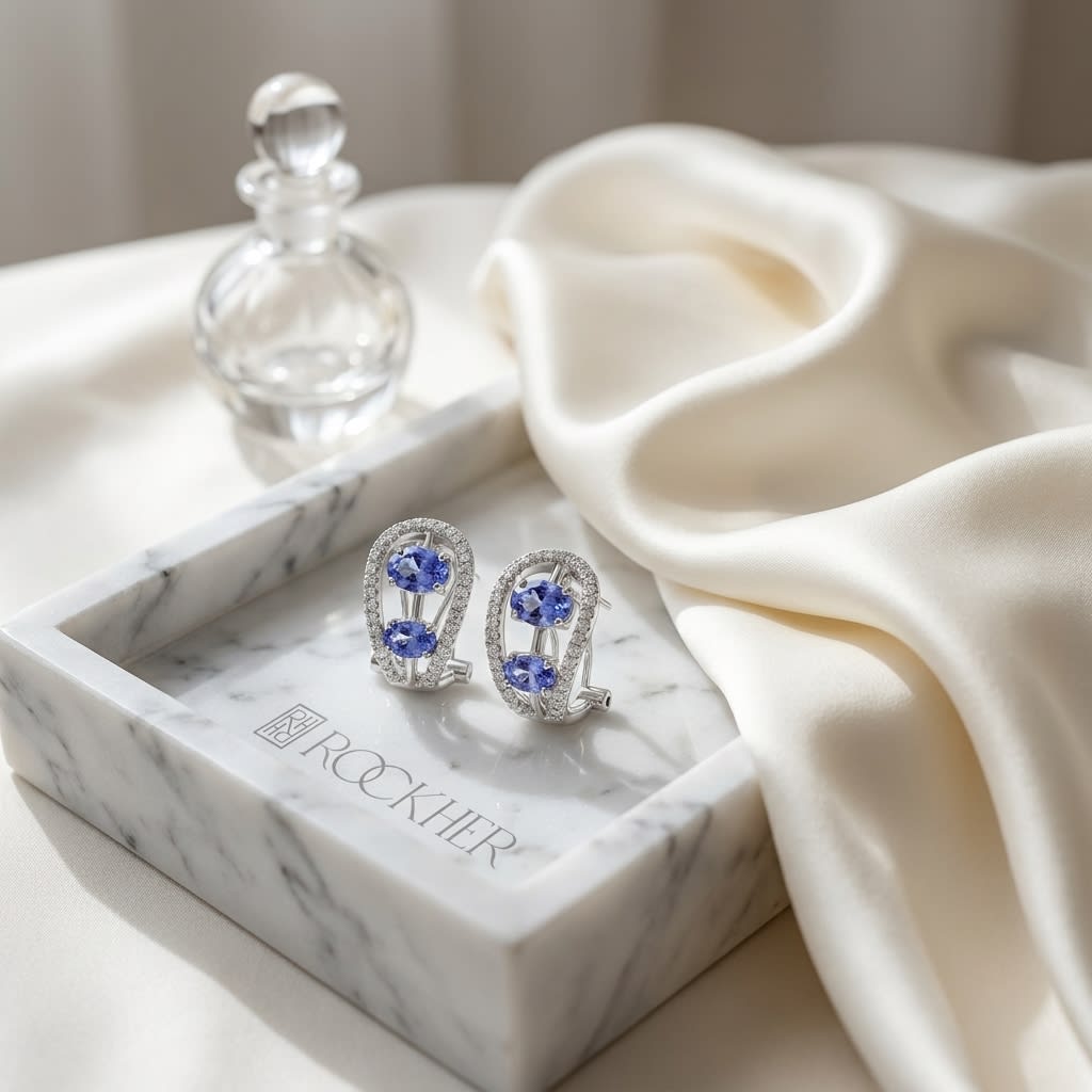 Tanzanite Round Brilliant Stud Earrings in 14K White Gold, on marble vanity tray with silk