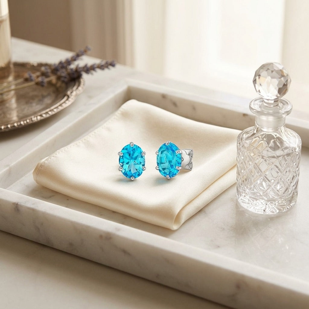 Blue Topaz Oval Stud Earrings in 14K White Gold - editorial