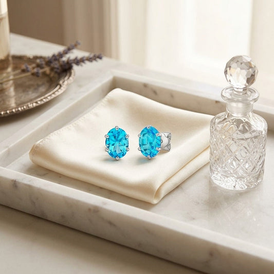Blue Topaz Oval Stud Earrings in 14K White Gold - editorial