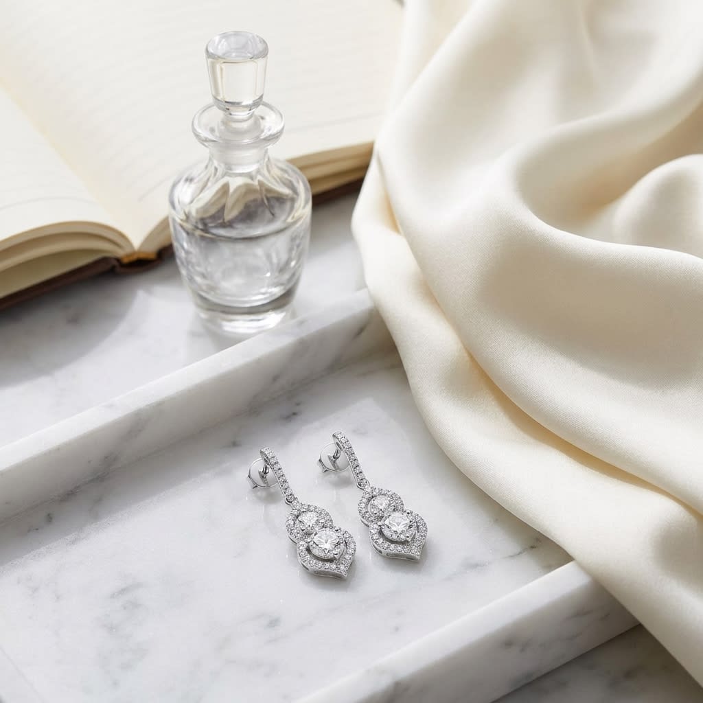 2 Stone Drop Earrings With Minaret Tips in 14K White Gold, on marble vanity tray with silk