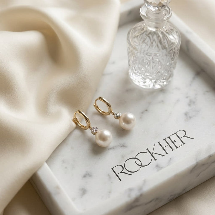 Akoya Pearl and Bezel Diamond Earrings in 14k White Gold 0.20ctw, on marble vanity tray with silk