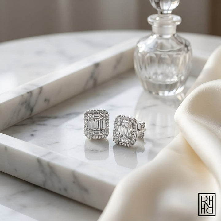 Emerald Round Brilliant Stud Earrings in 14K White Gold, on marble vanity tray with silk