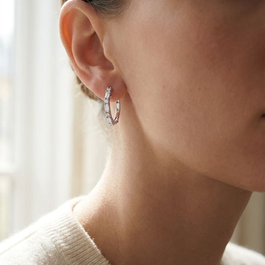 Diamond Baguette And Round Hoop Earrings in 14K White Gold, worn close-up portrait