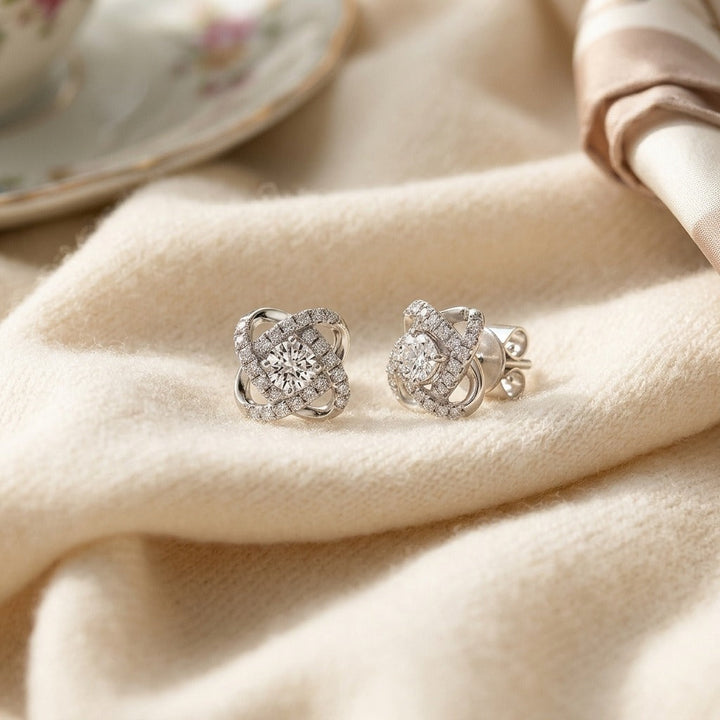 Diamond Pave Cross Knot Earrings with Round Centers in 14K White Gold - flat lay