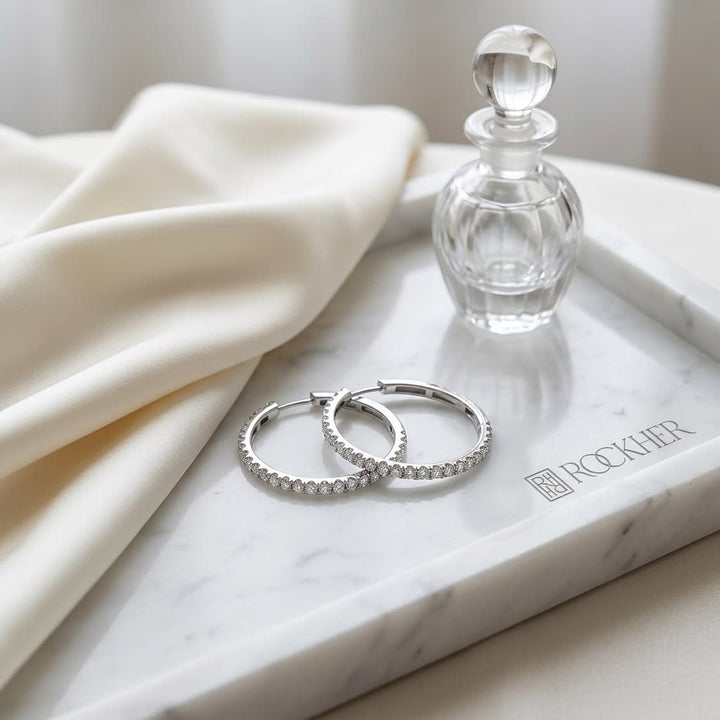 Diamond Pave Inside-out Hoop Earrings With Secure Closure in 14K White Gold, on marble vanity tray with silk