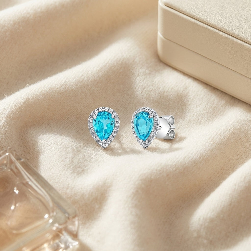 Blue Topaz & Diamond Halo Teardrop Earrings 0.18ctw in 14K White Gold - flat lay