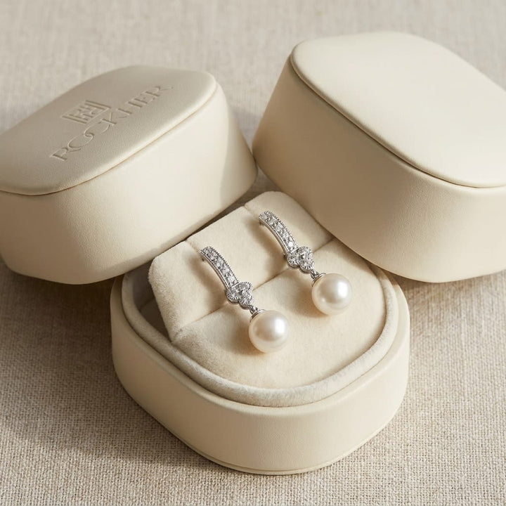 White Pearl And Diamond Dangle Earrings With Clover Top & Miillgrain Detail (8.0-8.5mm) (si), in navy velvet jewelry box