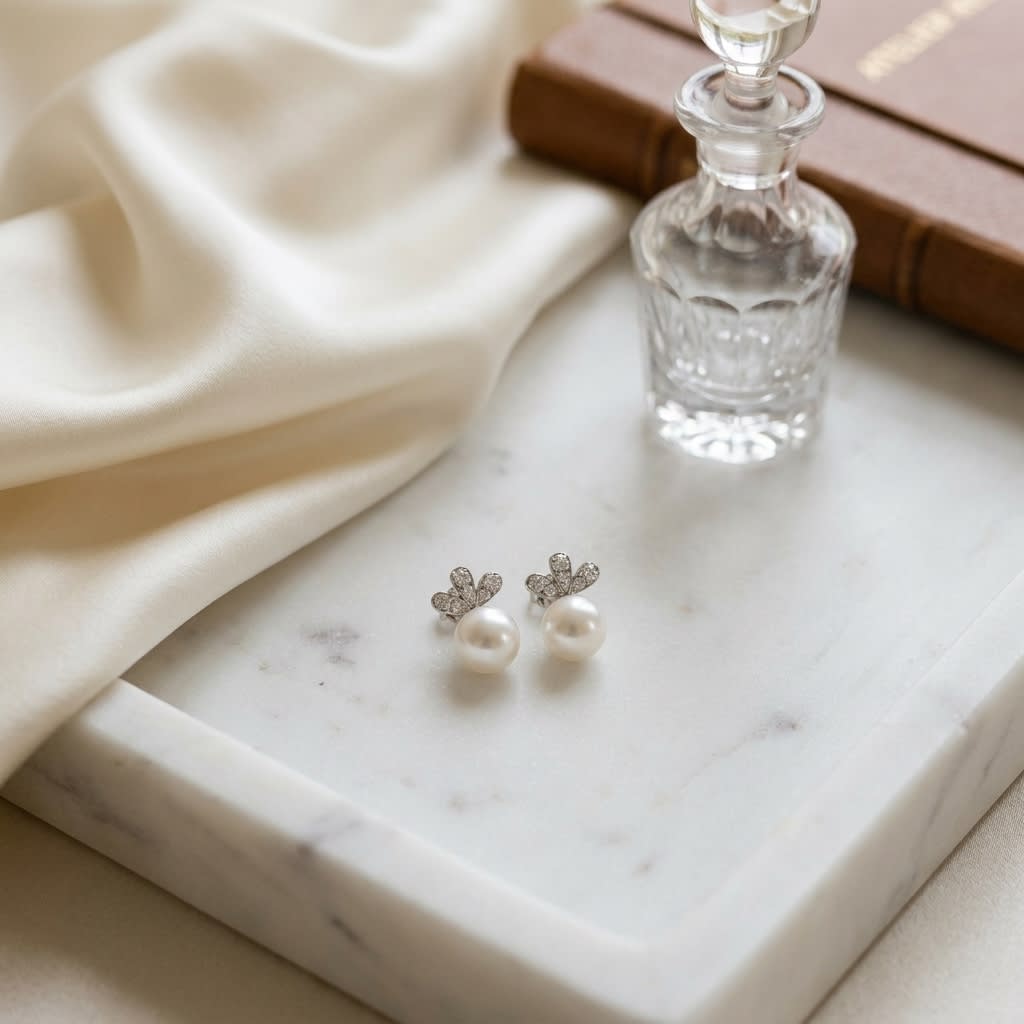 Pearl and Diamond Earrings in 14K White Gold, on marble vanity tray with silk