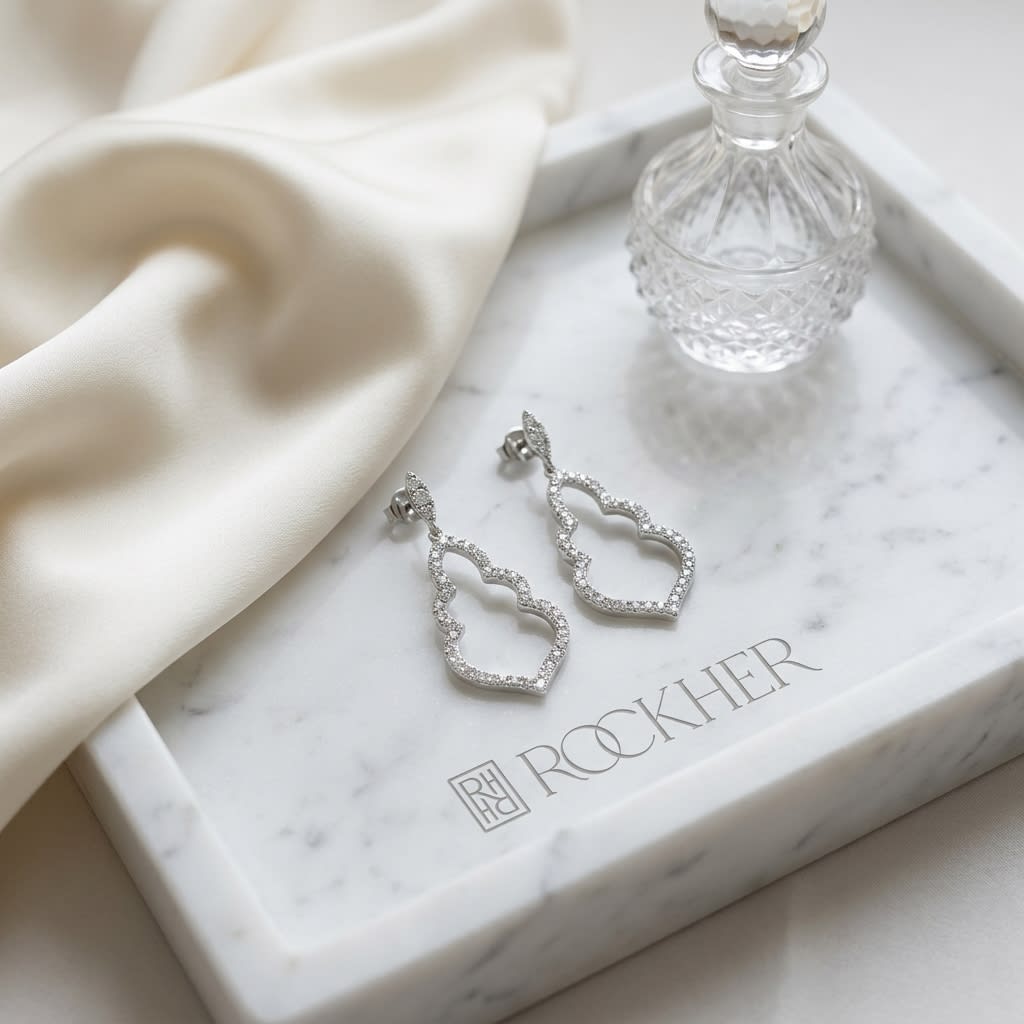 Diamond Open Damask Dangle Earrings in 14K White Gold, on marble vanity tray with silk