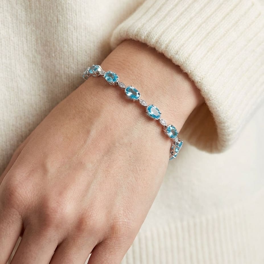Blue Topaz Oval Half-bezel And Diamond Pave East-west Bracelet in 14K White Gold, worn close-up portrait