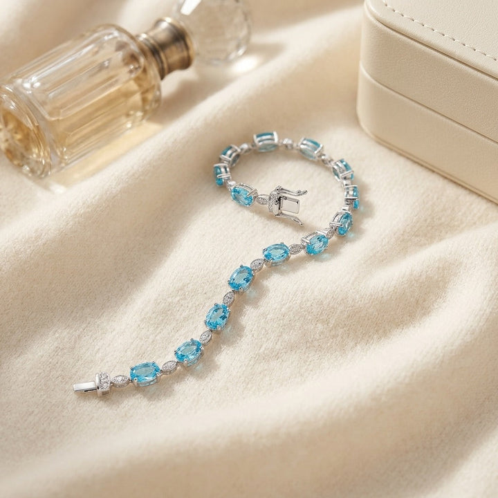 Blue Topaz Oval Half-Bezel & Diamond Pave East-West Bracelet in 14K White Gold - flat lay
