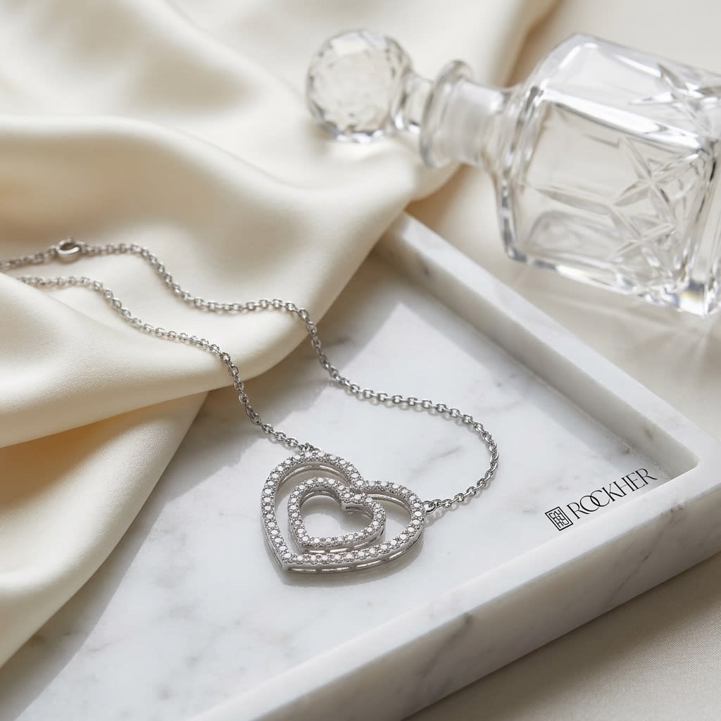 Diamond Double Heart Frame Necklace in 14K White Gold, on marble vanity tray with silk