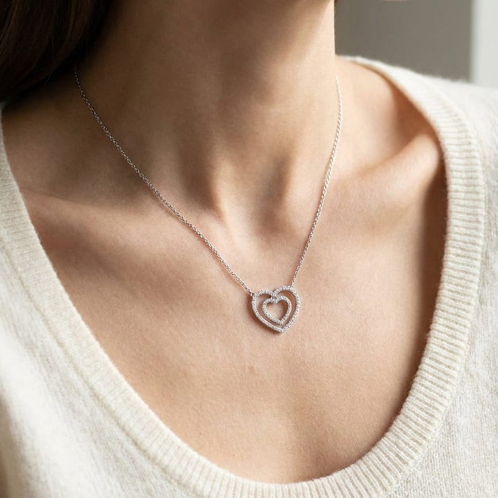 Diamond Double Heart Frame Necklace in 14K White Gold, worn close-up portrait