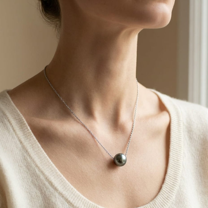 Black South Sea Pearl Floating Necklace in 14K White Gold, worn close-up portrait