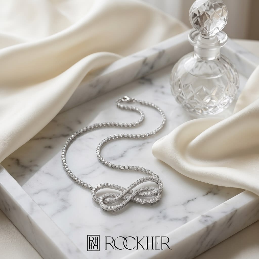 Diamond Double Infinity Necklace in 14K White Gold (2/3 Ct.tw.), on marble vanity tray with silk
