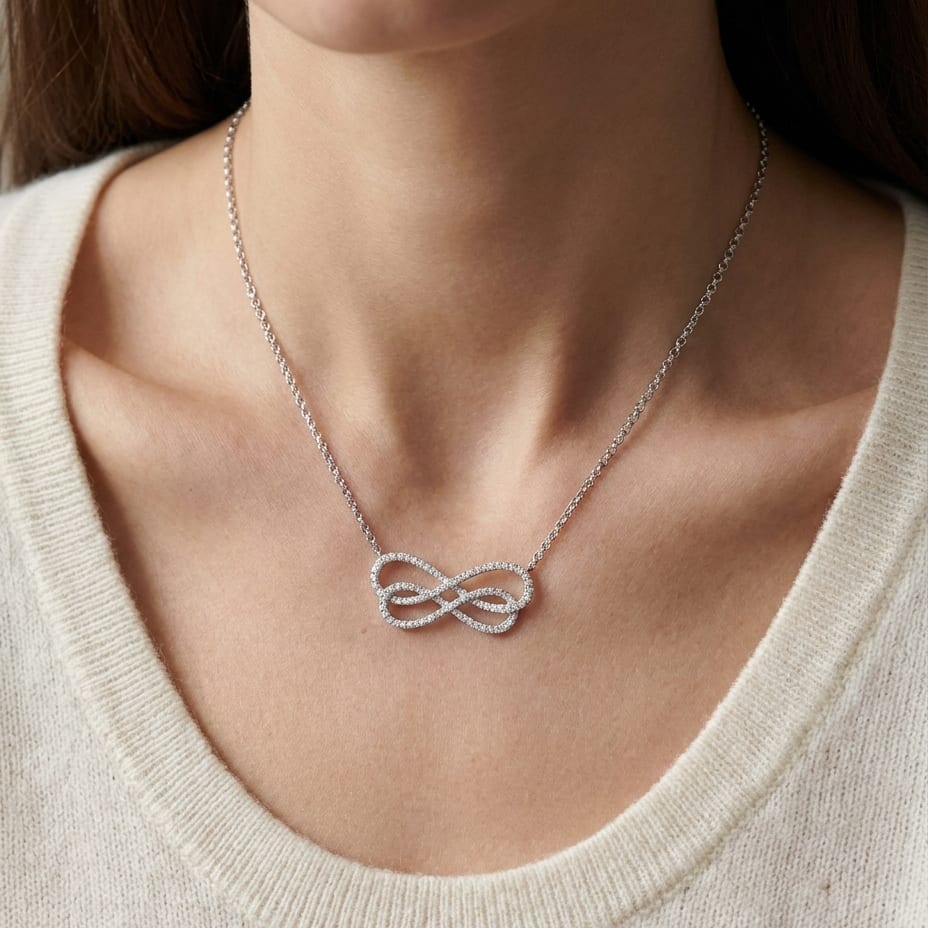 Diamond Double Infinity Necklace in 14K White Gold (2/3 Ct.tw.), worn close-up portrait