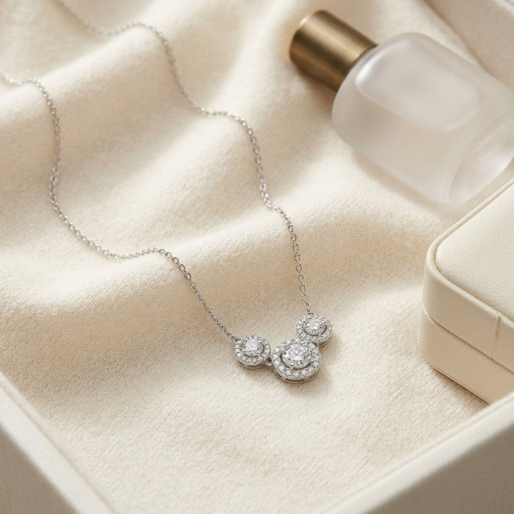 Diamond Three Stone Halo Necklace in 14K White Gold - flat lay