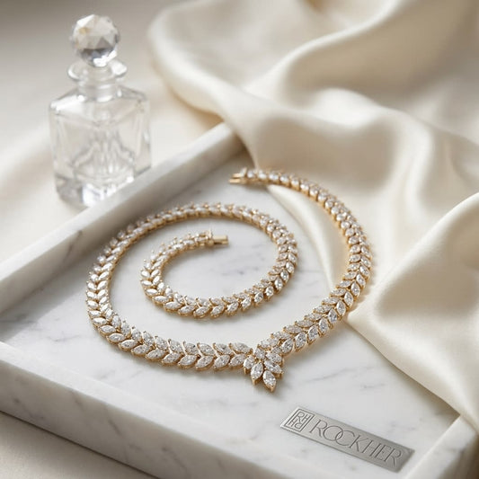 Diamond Laurel Leaf Necklace in 14K White Gold, on marble vanity tray with silk