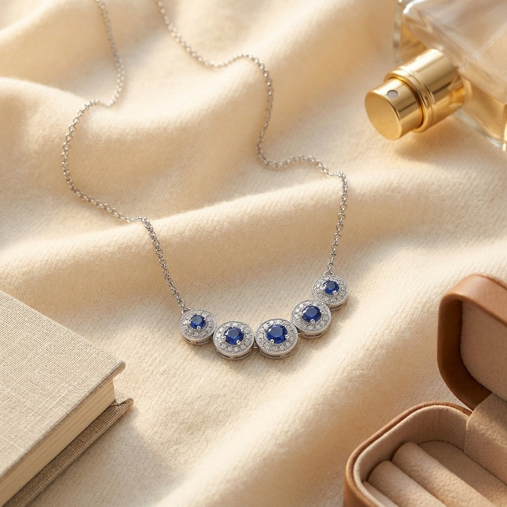 Sapphire & Diamond Graduated Curved Necklace in 14K White Gold - flat lay