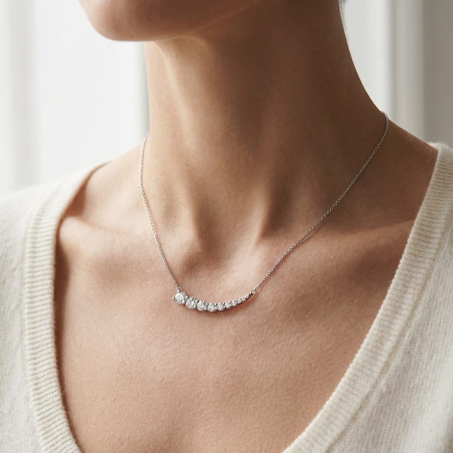 Diamond Round Graduated Prong-set Comet Necklace in 14K White Gold, worn close-up portrait