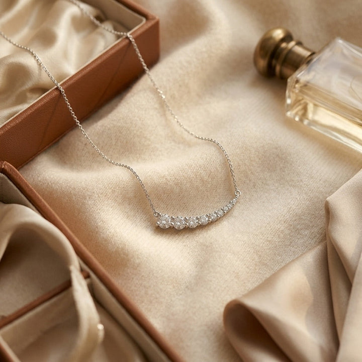 Diamond Round Graduated Prong-Set Comet Necklace in 14K White Gold - flat lay