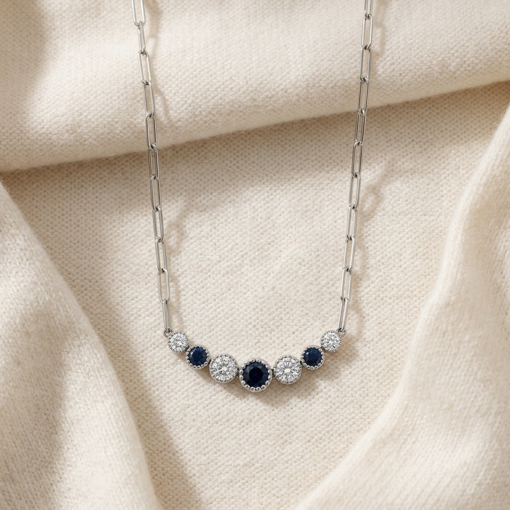 Sapphire & Diamond Graduated 7-Stone Necklace with Millgrained Edging in 14K White Gold - flat lay