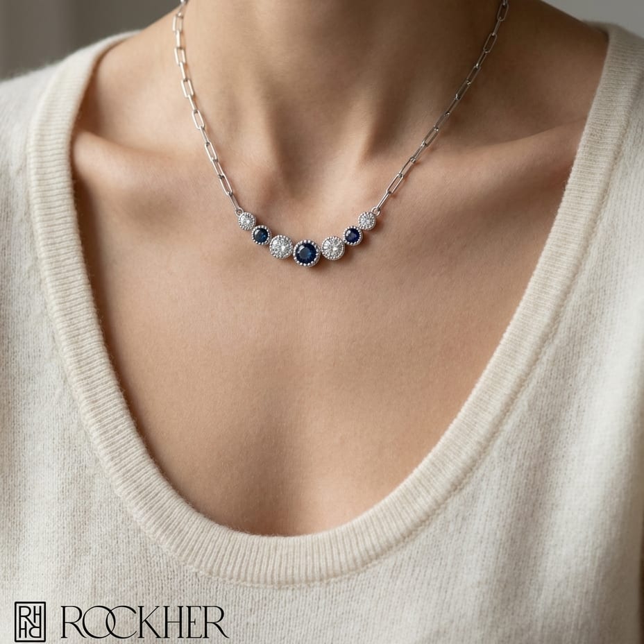 Sapphire And Diamond Graduated 7-stone Necklace With Millgrained Edging in 14K White Gold, worn close-up portrait