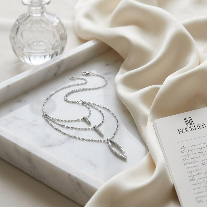 Diamond Pave Trio Icicles Layered Necklace in 14K White Gold, on marble vanity tray with silk