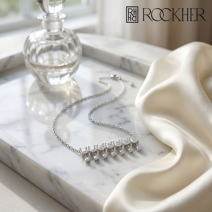 Diamond Princess Cut And Round Fringe Bar Necklace in 14K White Gold, 16-18 Inch Adj Chain, on marble vanity tray with silk