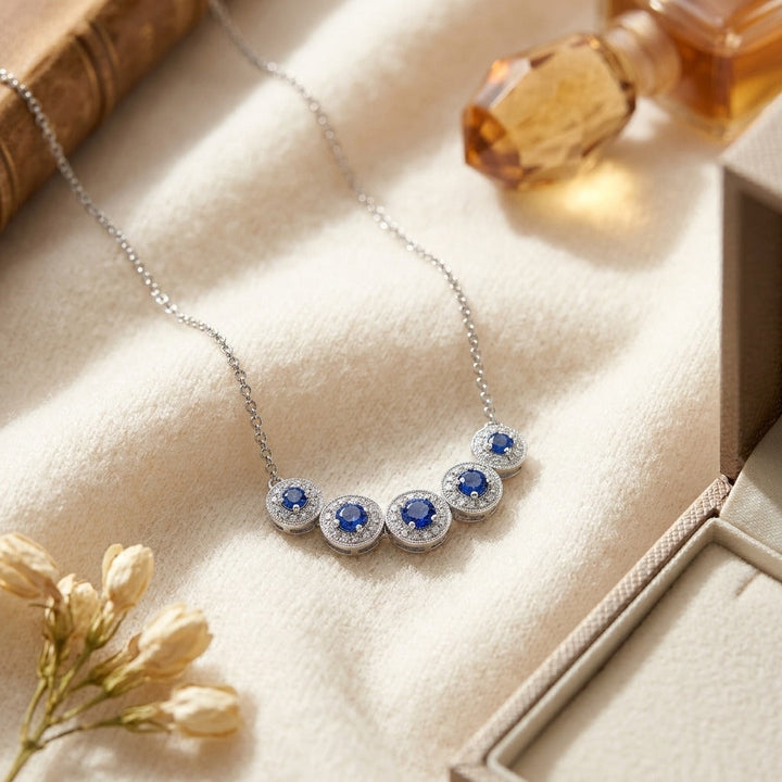 Sapphire & Diamond Five Section Graduated Halo Curved Necklace in 14K White Gold - flat lay