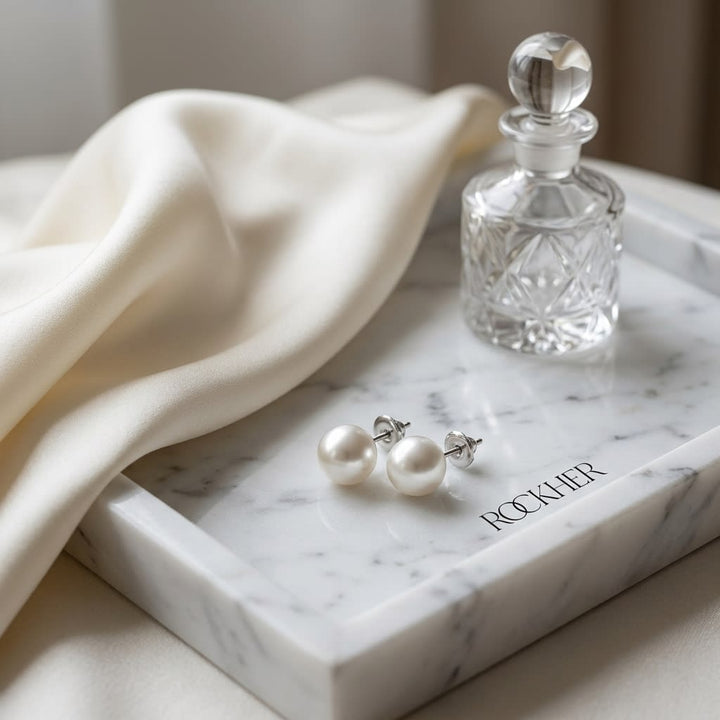 Cultured Pearl Pear Shape Stud Earrings in 14K White Gold, on marble vanity tray with silk