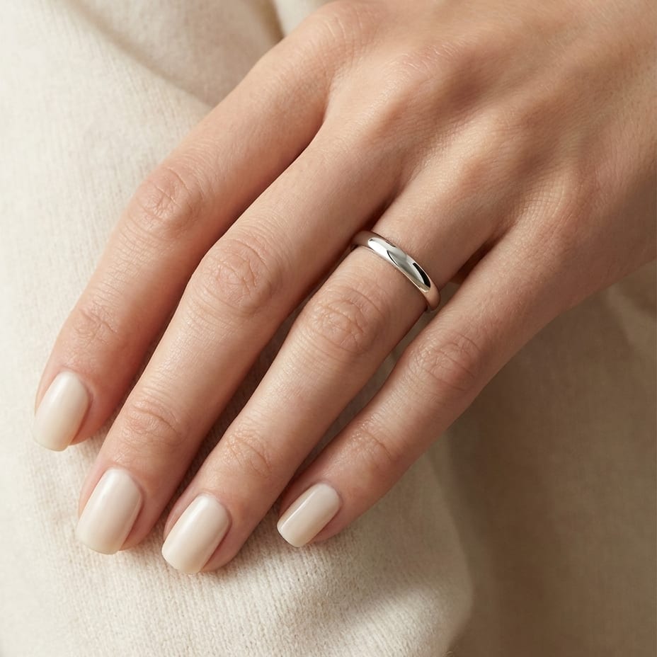 2.5mm Slightly Domed Traditional Oval Wedding Band in 14K White Gold, worn on hand, close-up
