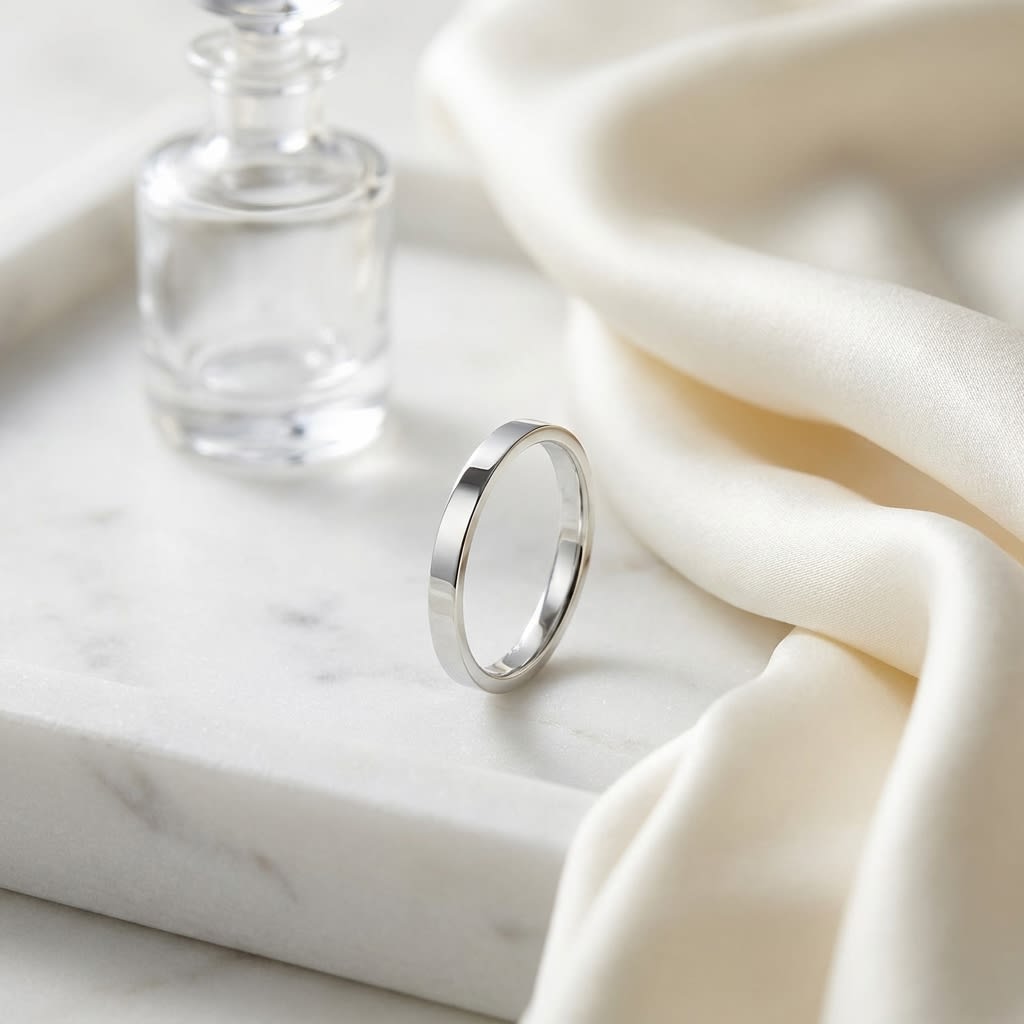2mm Traditional Flat Wedding Band in 14K White Gold, on marble vanity tray with silk