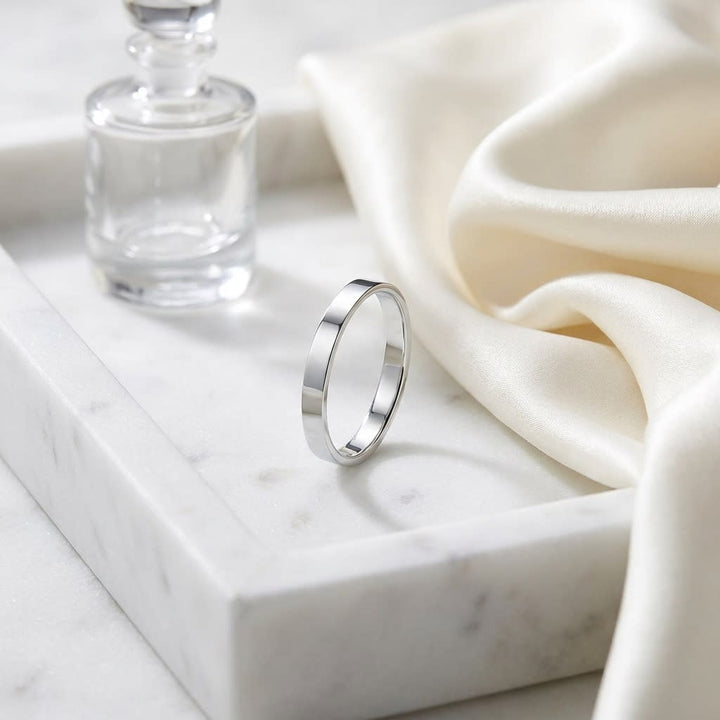 3mm Traditional Flat Wedding Band in 14K White Gold, on marble vanity tray with silk