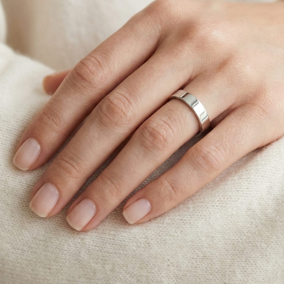 4mm Traditional Flat Wedding Band in 14K White Gold, worn on hand, close-up