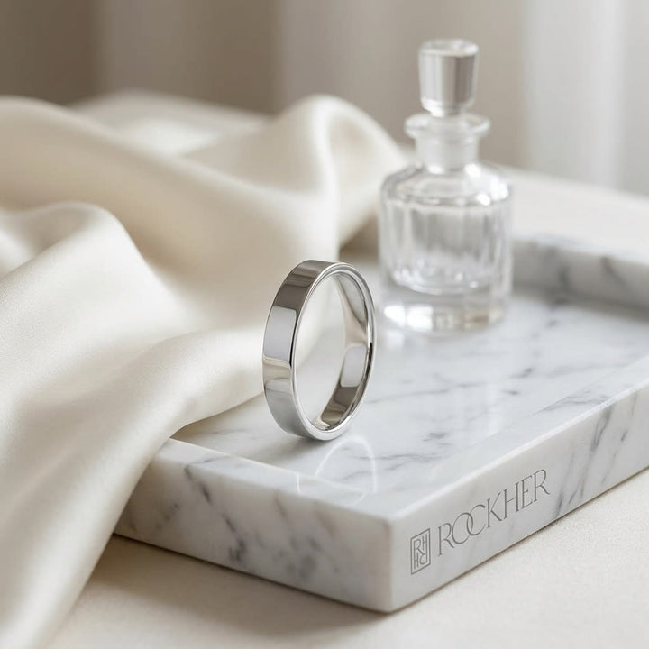 4mm Traditional Flat Wedding Band in 14K White Gold, on marble vanity tray with silk