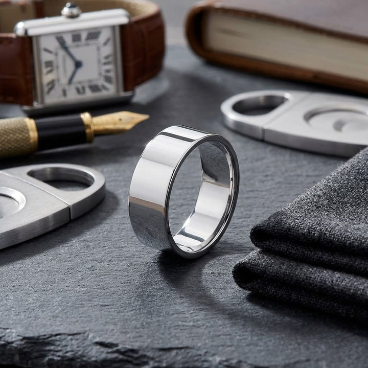 8mm Traditional Flat Wedding Band in 14K White Gold, on walnut surface with pocket square