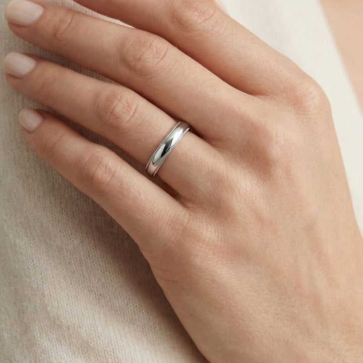 4mm Slightly Domed Traditional Oval Milgrain Wedding Band in 14K White Gold, worn on hand, close-up