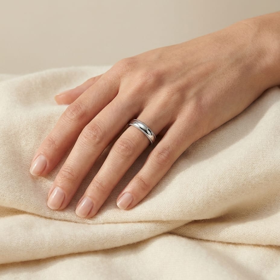 4mm Slightly Domed Traditional Oval Milgrain Wedding Band in 14K White Gold, worn on hand, full view