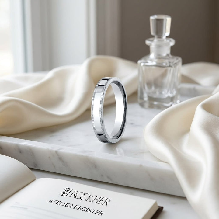 4mm Flat Milgrain Comfort-Fit Wedding Band in 14K White Gold, on marble vanity tray with silk