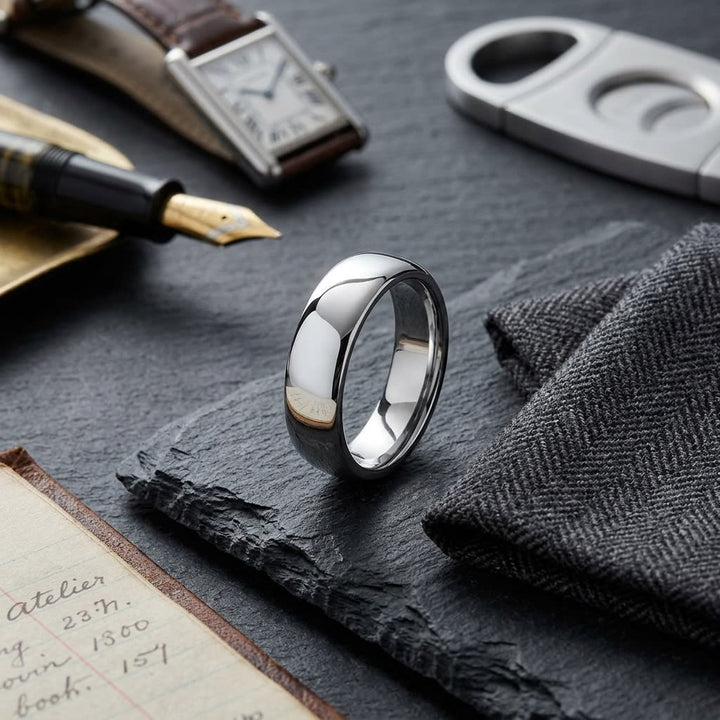 6.5mm Deluxe Comfort-Fit Wedding Band in 14K White Gold, on walnut surface with pocket square