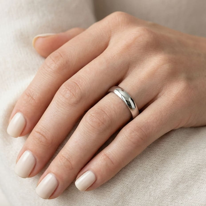4mm Low Dome Wedding Band in 14K White Gold, worn on hand, close-up