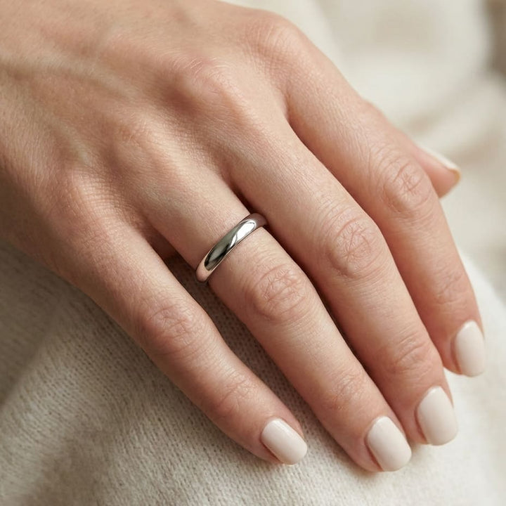 2mm Slightly Domed Comfort-Fit Wedding Band in 14K White Gold, worn on hand, close-up