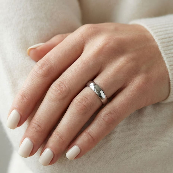 4mm Slightly Domed Comfort-Fit Wedding Band in 14K White Gold, worn on hand, close-up