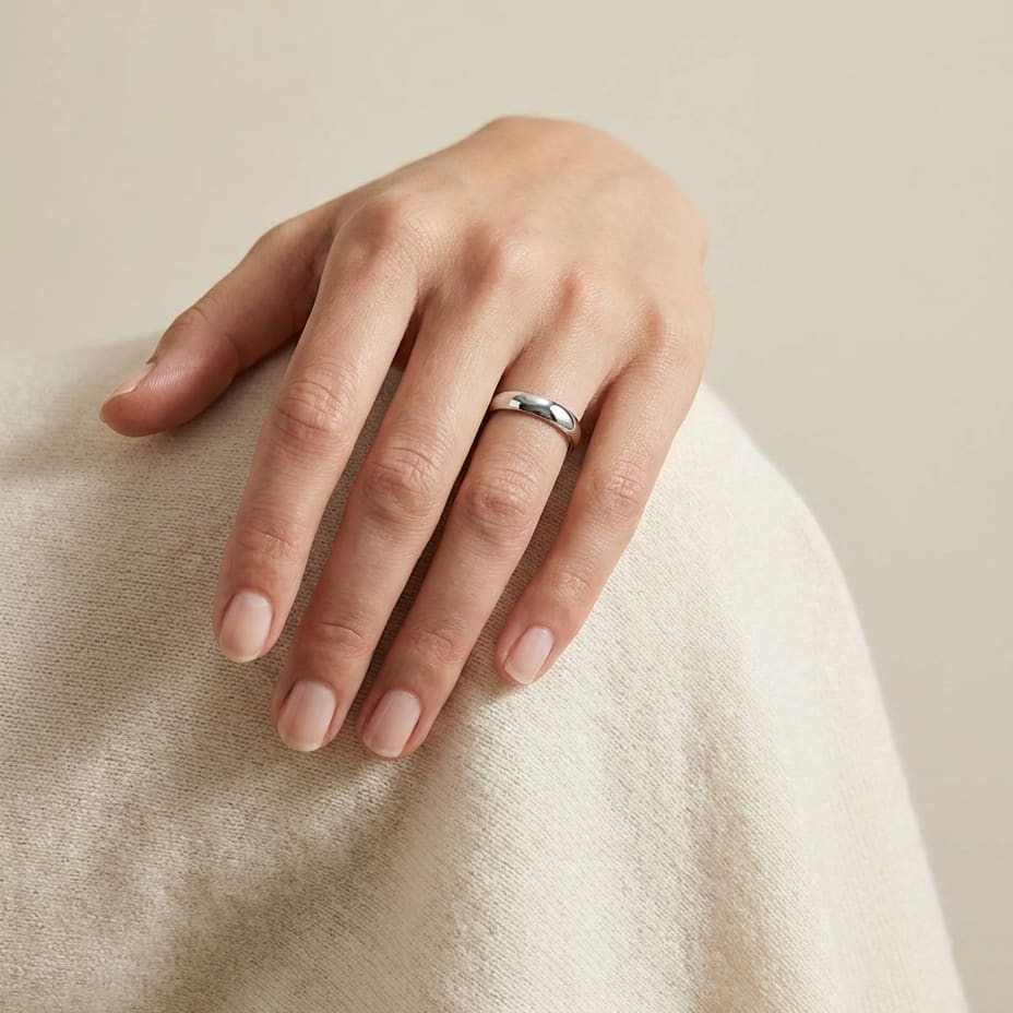 4mm Slightly Domed Comfort-Fit Wedding Band in 14K White Gold, worn on hand, full view
