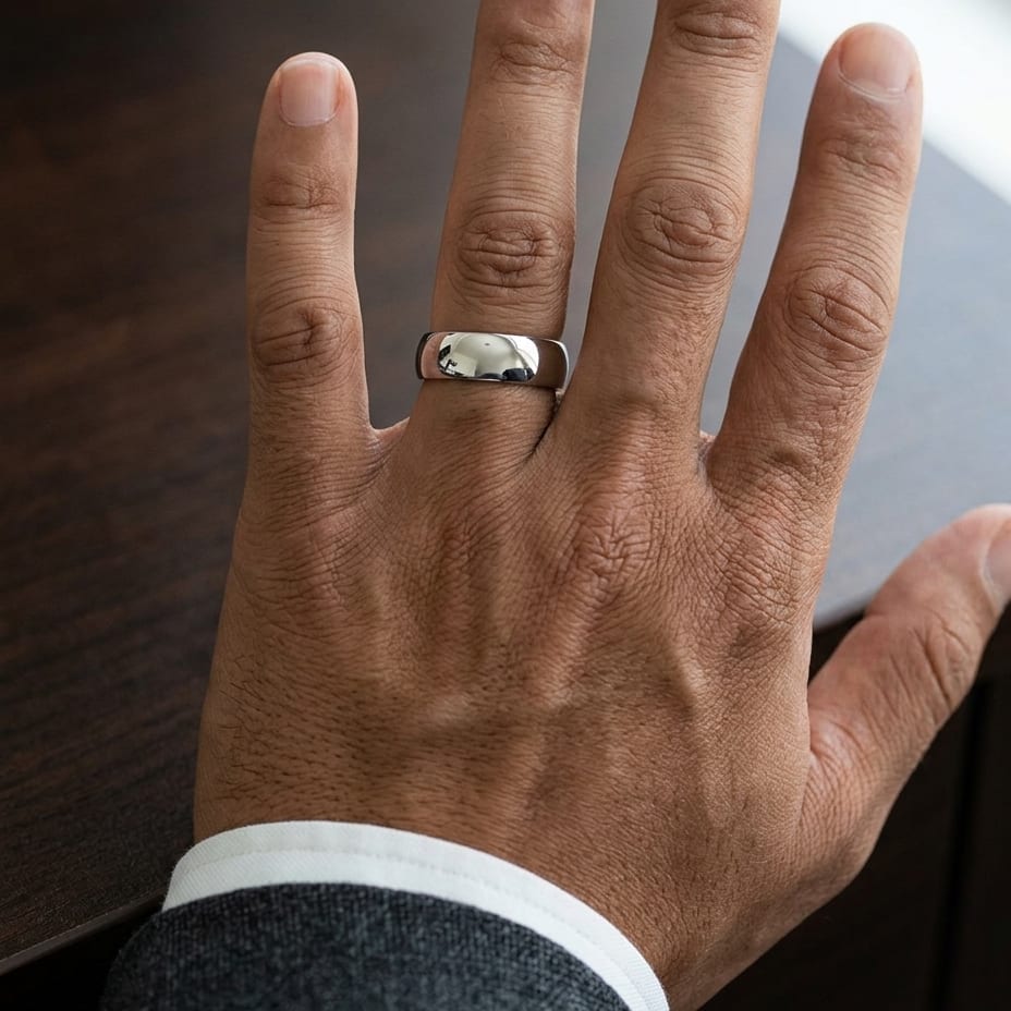 7mm Slightly Domed Comfort-Fit Wedding Band in 14K White Gold, worn on hand, masculine close-up