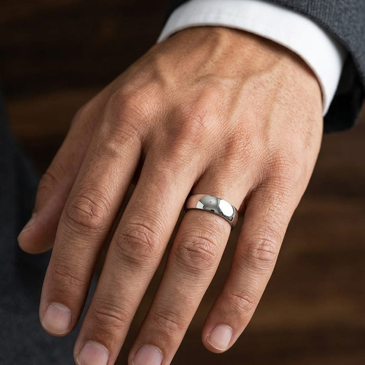 8mm Slightly Domed Comfort-Fit Wedding Band in 14K White Gold, worn on hand, masculine close-up