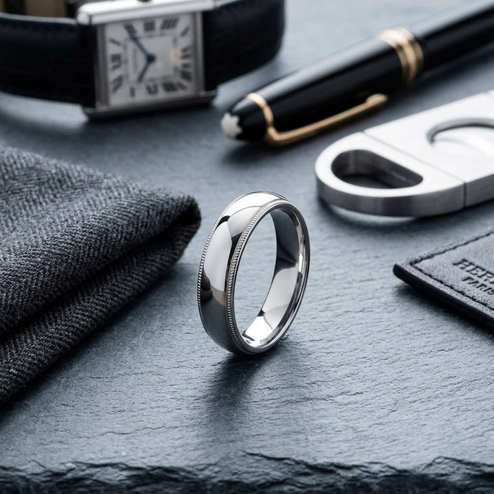 5mm Slightly Domed Milgrain Comfort-Fit Wedding Band in 14K White Gold, on walnut surface with pocket square