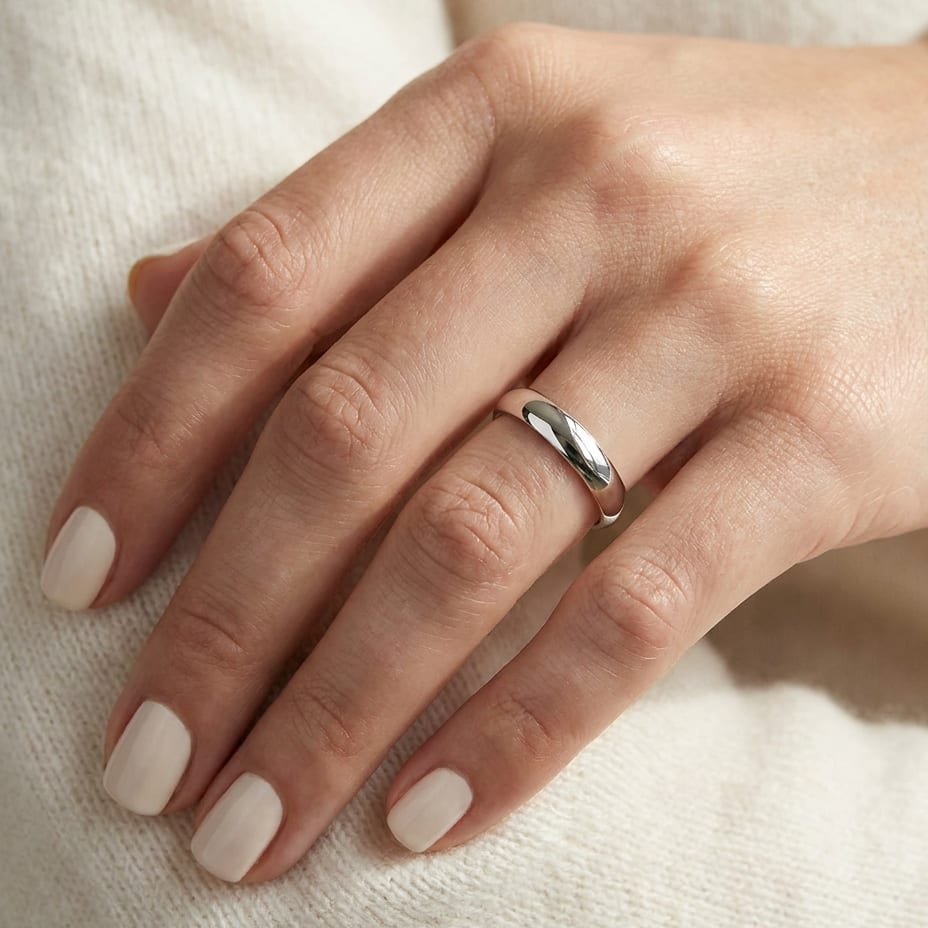 4mm Slightly Domed Super Light Comfort-Fit Wedding Band in 14K White Gold, worn on hand, close-up