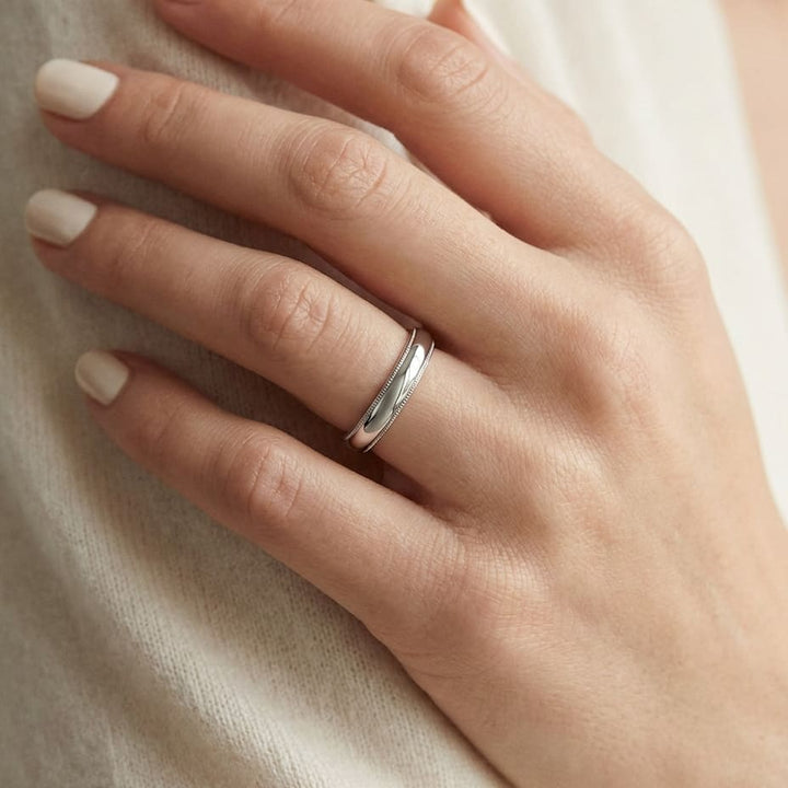 4mm Slightly Domed Super Light Milgrain Comfort-Fit Wedding Band in 14K White Gold, worn on hand, close-up